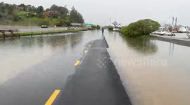 a path in Sausalito, Northern California is flooded by torrential rain, high tides and run off from recent atmospheric rivers