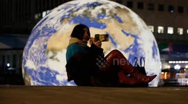 Artist Luke Jerram's ethereal floating earth installation appears ahead of Canary Wharf's Winter Lights Festival