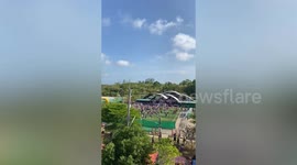 Bungling helicopter pilot blows over stadium roof injuring eight during children's event in Thailand