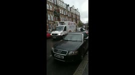 London cavalry policeman passing Willesden Green Street