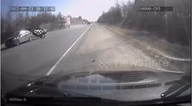 Close Call: Car Carrying Trailer Loses Control after Overtaking a Truck
