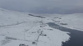 Stunning aerial shot as winter returns with heavy snow over the Shetland Islands
