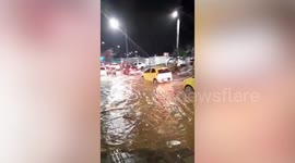 Cars battle through heavy flood after torrential rains in Colombia