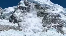 Avalanches crashing off the sides of Mount Everest and surrounding peaks