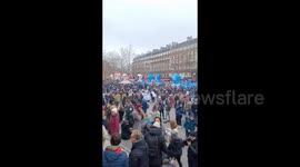People gather to protest against pension reform in Paris, France