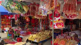 Crowded food market in Vietnam. People preparing for the New Year celebration (TET)