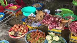 Crowded food market in Vietnam. People preparing for the New Year celebration (TET)