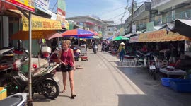 Crowded food market in Vietnam. People preparing for the New Year celebration (TET)