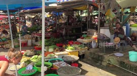 Crowded food market in Vietnam. People preparing for the New Year celebration (TET)
