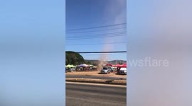 Dust devil tornado destroys market stalls on hot day in northern Thailand
