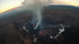Aerial footage shows molten magma flowing down side of active volcano in Hawaii