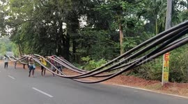 Workers carry 200 ft pipe for over 2 miles on their shoulder to bring water to the remote villages in eastern India