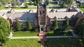 Aerial scenes focused on the tower of Notre Dame College, South Euclid, Ohio