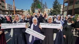 Palestinian students take part in a protest the burning of a copy of the Muslim holy book of Koran by a far-right politician Outside the Turkish Embassy in Stockholm at their school in Khan Yunis, in the southern Gaza Strip