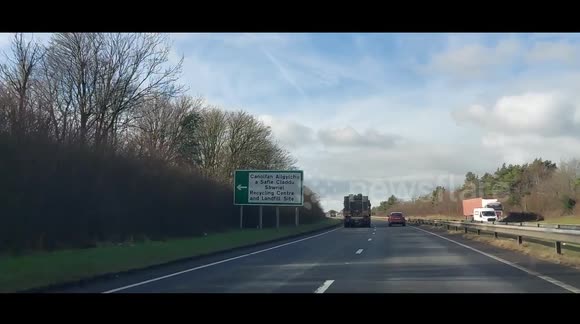 Military convoy on A48 in Carmarthenshire. Three vehicles carrying tanks
