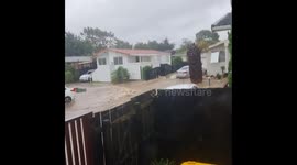 The start of the flood at Clover drive in Henderson, Auckland