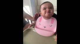Expressive baby pulls a funny face