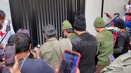 Burmese protesters re-enact military attacks of civilians at rally marking military coup