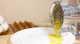 Chicken and Quail Eggs Grinding in a Meat Grinder