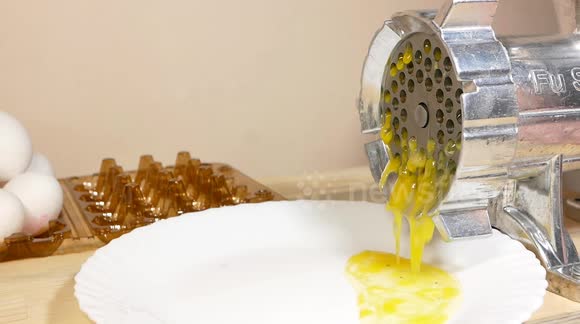 Chicken and Quail Eggs Grinding in a Meat Grinder
