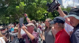 Protesters play song “Highway to hell!” as Cardinal George Pell’s funeral hearse departs St Mary’s Cathedral in Sydney, Australia
