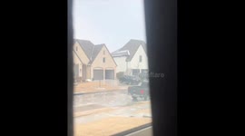 US ice storm: SUV fails to get into garage and slides down icy path in Dallas