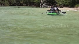 Two amateur kayak paddlers who nearly capsized to burst out laughing