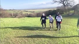One of Britain's oldest runners crossed the finish line of 15-mile run with fellow jogger holding his hand
