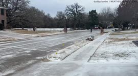 Texans seen ice skating in suburban street as cold snap brings wintry conditions