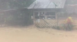 Muddy flash floods ravage villages brought by monsoon and shear line in the Philippines