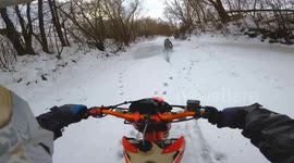 Death-defying escape as two motorbike riders fall through ice during a trail ride in Russia