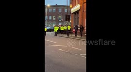 Police draw batons as Liverpool and Wolves fans clash after hosts beat LFC 3-0