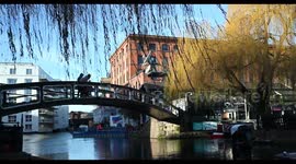 A close up view of those on the Iron Footbridge over Regents Canal within Camden, London, United Kingdom