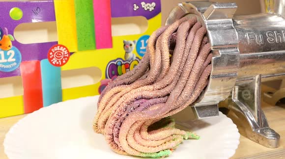 Satisfying footage as textured slime is squeezed through meat grinder