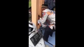 A child was safely rescued after his head was trapped between walls in Indonesia