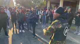 People gather out Side Thomas Knyvett college