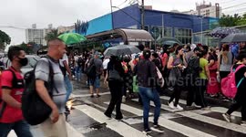 Rain causes inconvenience in Sao Paulo, Brazil and people take crowded buses