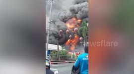 Large tongues of flame tear bus terminal in Philippines