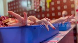Disgusting video of fresh chicken legs being sold on the street