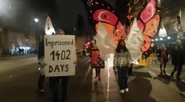 Supporters march in night carnival for imprisoned Julian Assange in London