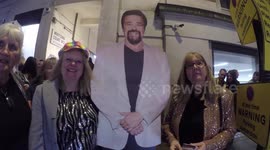 Donny Osmond superfans represent him at the Whats On Stage Awards held in London. They carry a cardboard standee of him to all his shows