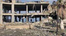 Palestinians inspect a destroyed a site after being attacked by Israeli aircrafts