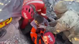 Child Pulled From Rubble Smiles At Rescuers in Kahramanmaras, Turkey