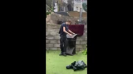 Little brother tries to break a chair in the garden but ends up landing on his back 