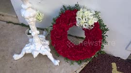 Red wreath commemorates victims of devastating earthquakes outside London Turkish Consulate General