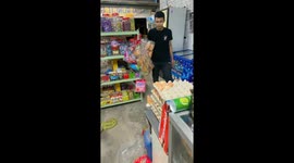 Cat jumps out of box scaring man in Malaysia's shop