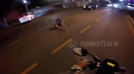 WTF Moment: Drunken Pedestrian Sitting in The Middle of the Road