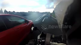 Reckless Driving: Man in Red Ibiza Overtakes Motorcyclist Risking His Life