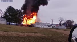 Dashcam Footage Captures a Barn on Fire Emitting Fumes of Black Smoke