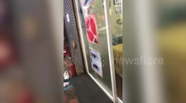 German man saves kitten trapped in shop wall in Cambodia